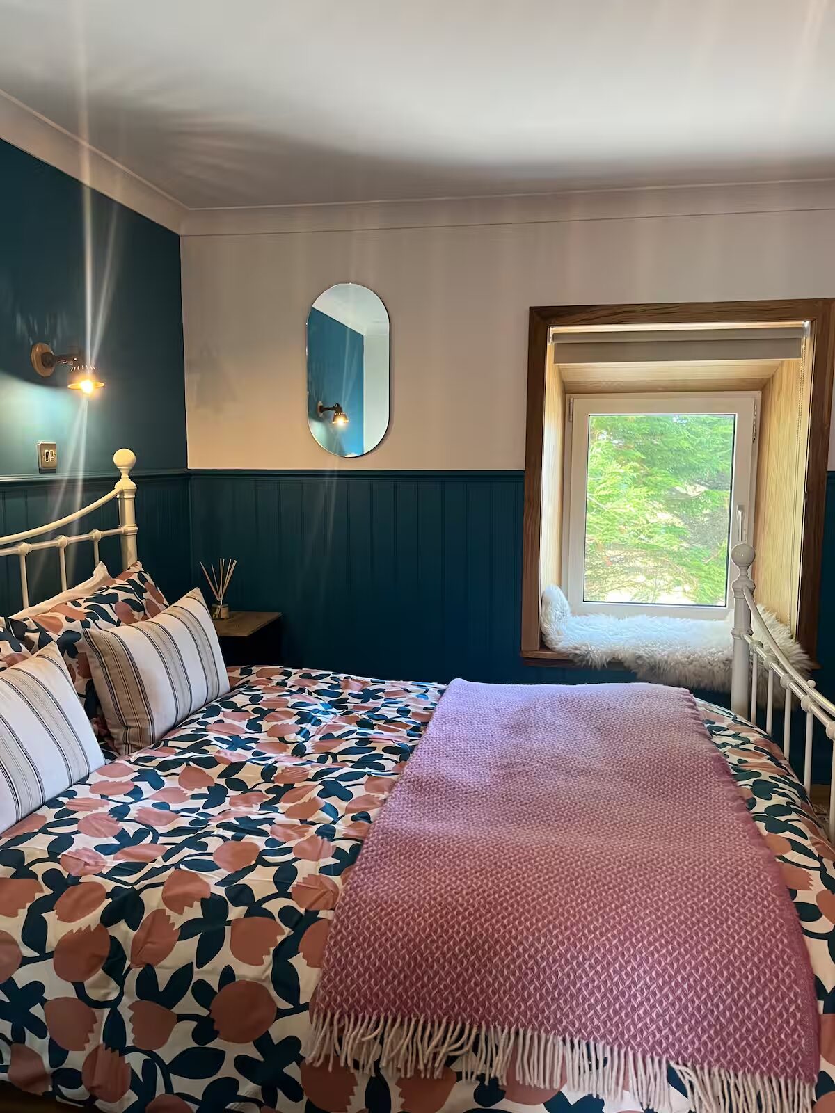 The restored Blue Room at Clachamish House — deep teal walls and a king ensuite